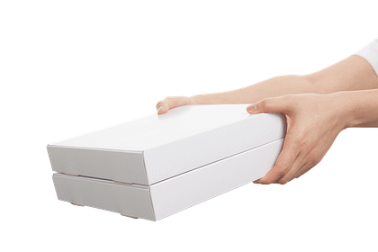Hands holding 2 white boxes and offering them to someone
